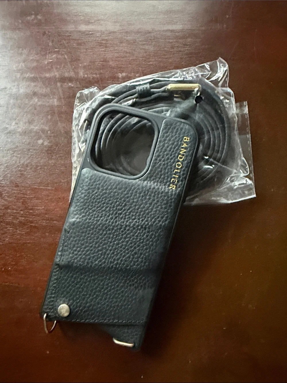 BANDOLIER Black Leather Crossbody Phone Case with Strap for iPhone 15 Pro